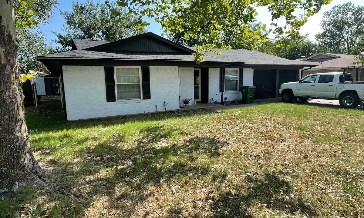Professional roofing crew working on a residential roof in Cornelius